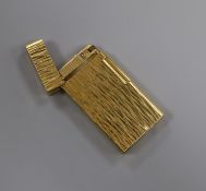 A Caran Dache gold plated lighter