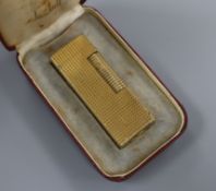 A Dunhill gold plated rollagas lighter