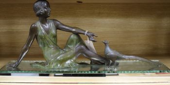 An Art Deco spelter figure of a seated woman with mirror base length 65.5cm