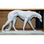 An Art Deco style painted model of a Borzoi 56cm wide x 31cm high