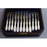 A cased set of 6 (ex 12) pairs of Victorian mother of pearl handled silver dessert eaters, Martin,
