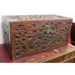 A Cantonese camphor wood chest, carved with dragons and stylised clouds W.101cm