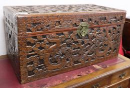 A Cantonese camphor wood chest, carved with dragons and stylised clouds W.101cm