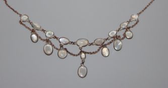 An early 20th century metal and moonstone set drop necklace, 42cm.