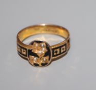 A 19th century 15ct, black enamel and seed pearl mourning ring (a.f.), size O/P