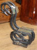 A pair of Victorian cast iron serpent bench ends W.67cm approx.