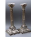 A pair of late Victorian silver corinthian column candlesticks, James Dixon & Sons, Sheffield,