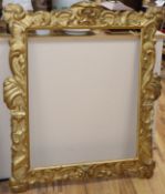 A 19th century carved and giltwood picture frame, aperture 74 x 62cm