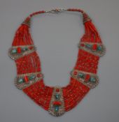 A continental 925 white metal, turquoise and multi strand coral bead necklace, approx. 48cm.