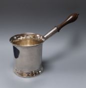 A George III silver brandy saucepan, with turned wooden handle, John King, London, 1777, length