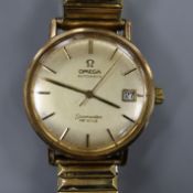 A gentleman's yellow metal Omega Seamaster De Ville automatic wrist watch, on associated flexible