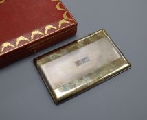 A Cartier gilt white metal and 14k yellow metal cigarette case, with engraved initials, signed and