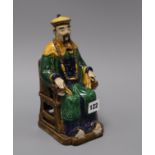 A Chinese seated figure of a mandarin 24cm high