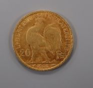 A French 1906 gold 20 franc coin.