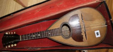 An early 20th century cased mandolin 61cm long