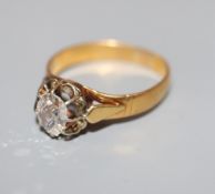 A yellow metal and claw set solitaire diamond ring, (stone a.f.), size P.