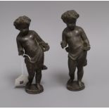A pair of lead figures of cherubs Height 21cm