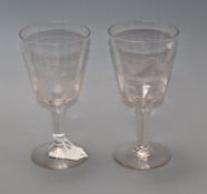 A pair of large etched wine glasses 20cm high