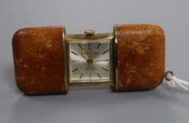 A Daniel Perett leather cased travelling watch