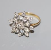 A yellow metal and diamond set 'snowflake' cluster ring, size O.