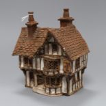 A studio pottery model of a cottage 19cm high