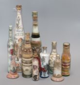 A group of Isle of Wight and other sand picture bottles tallest 37cm