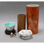 Two Chinese famille rose dishes, a figure of a boy, a porcelain brush pot and a bamboo brush pot