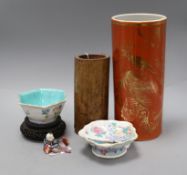 Two Chinese famille rose dishes, a figure of a boy, a porcelain brush pot and a bamboo brush pot