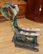 A pair of Victorian cast iron serpent bench ends W.72cm approx.