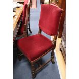 A set of six red velvet upholstered chairs