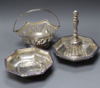 A silver hand bell, a silver bonbon basket and a pair of George V silver and enamel octagonal
