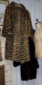 A faux leopard coat and a beaver fur coat