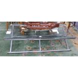 A glass and chrome coffee table W.142cm