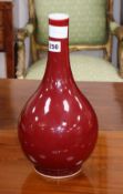 A Chinese sang de boeuf bottle vase, Kangxi mark, height 35.5cm