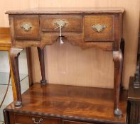 An early 18th century oak three drawer lowboy W.76.5cm