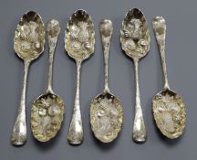 A set of six George II parcel gilt silver Old English pattern later decorated 'berry' spoons,