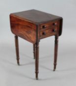 An early Victorian mahogany work table, with double flap top and two end drawers, on turned and