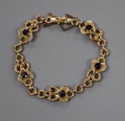 An Edwardian 9ct, amethyst and seed pearl set bracelet.