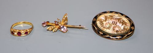 An 18ct, ruby and diamond five stone ring, a mourning brooch and a 9ct gem set bug brooch.