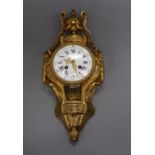 A French ormolu cartel clock, 19th century, having white enamelled Roman dial with blue numerals