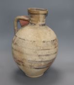 An antique Cypriot pottery jar, circa 700 BC, having banded decoration of varying width and fitted