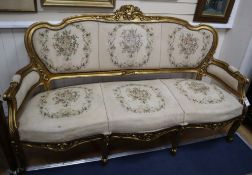 A Louis XV style gilt carved wood settee, on cabriole legs W.173cm
