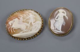Two yellow metal mounted oval cameo brooches, largest 55mm.
