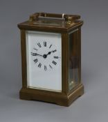 A French gilt brass carriage timepiece with white enamelled Roman dial