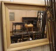 A pine framed mirror, W.105cm