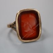 A 9ct gold and carnelian intaglio ring, carved with the head of a Roman soldier to dexter, size M.