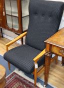 Two Scandanavian teak mid 20th century armchairs, re-upholstered