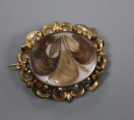 A Victorian yellow metal mounted hair mourning brooch, 5cm.