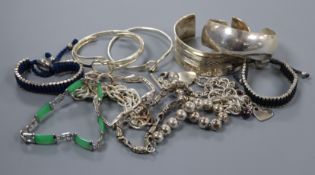 A small group of assorted silver and white metal bracelets etc.