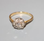 A yellow metal and diamond cluster ring, size O.